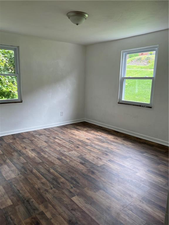 2031 McKinney Road Monroeville, PA 15146 - Photo 10 of 13 an empty room with wooden floor and windows