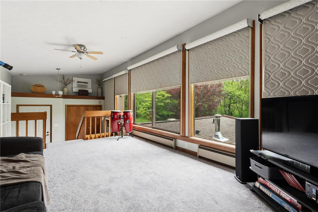 1940 Armstrong Road Fairborn, OH 45324 - Photo 12 of 48 This bright living space features expansive windows and durable carpeting, offering serene outdoor views.