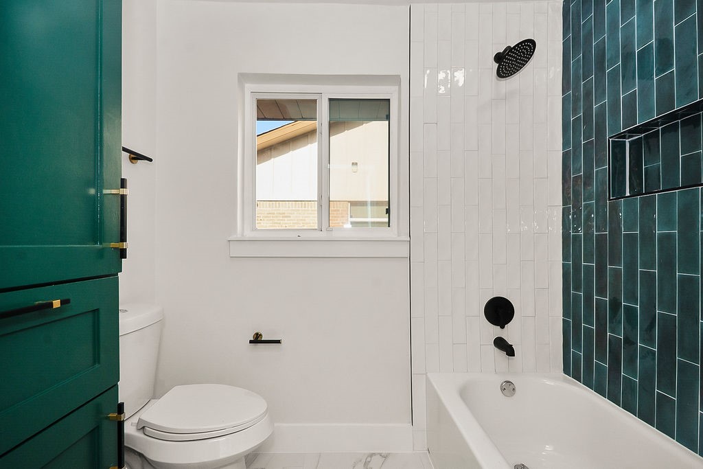 6106 Rutherglenn Drive Houston, TX 77096 - Photo 33 of 41 Updated bathroom featuring bold designer tile, modern fixtures, and contemporary finishes.