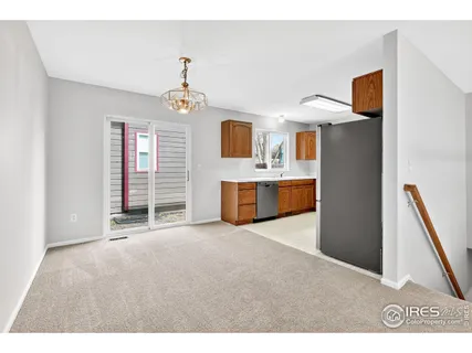 a kitchen with stainless steel appliances a refrigerator and a stove
