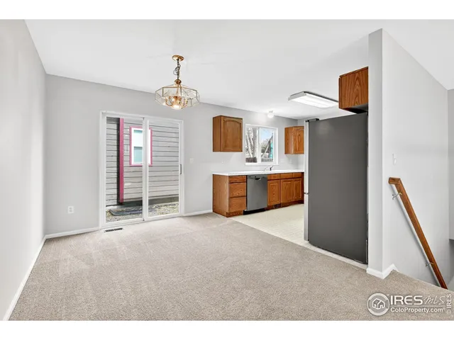 a kitchen with stainless steel appliances a refrigerator and a stove