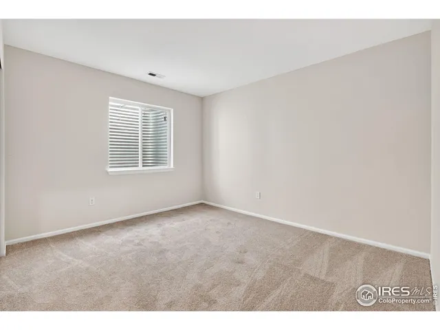 a bathroom with a granite countertop sink a toilet a mirror and bathtub