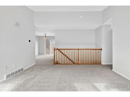 a living room with stainless steel appliances kitchen island granite countertop a dining table and chairs