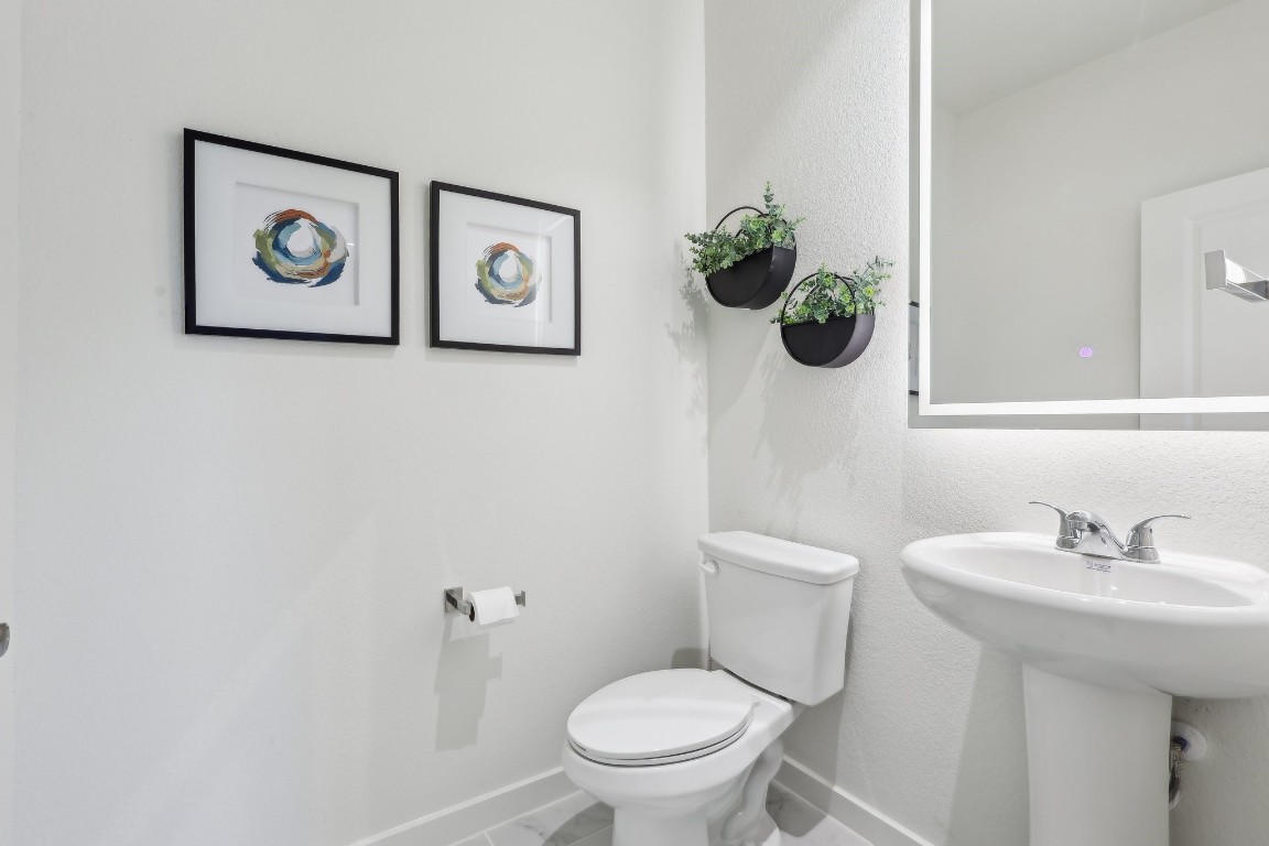 631 Canvas Avenue Fulshear, TX 77441 - Photo 13 of 30 a bathroom with a toilet and a sink