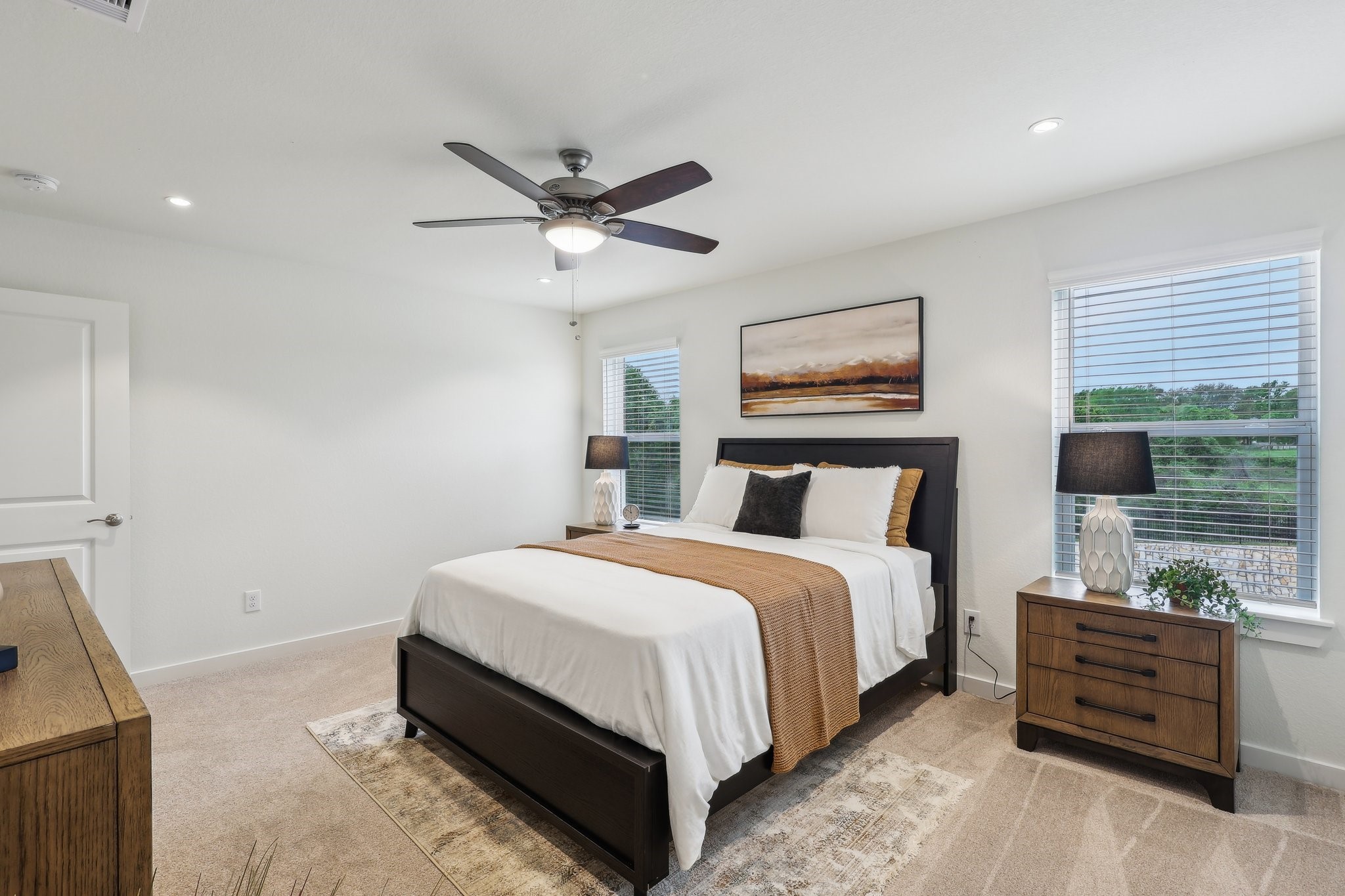 631 Canvas Avenue Fulshear, TX 77441 - Photo 14 of 30 a spacious bedroom with a bed and a window