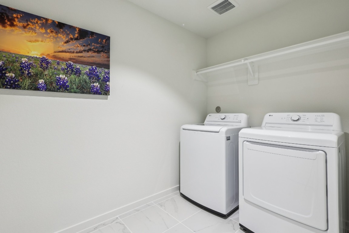 631 Canvas Avenue Fulshear, TX 77441 - Photo 15 of 30 a utility room with dryer and washer