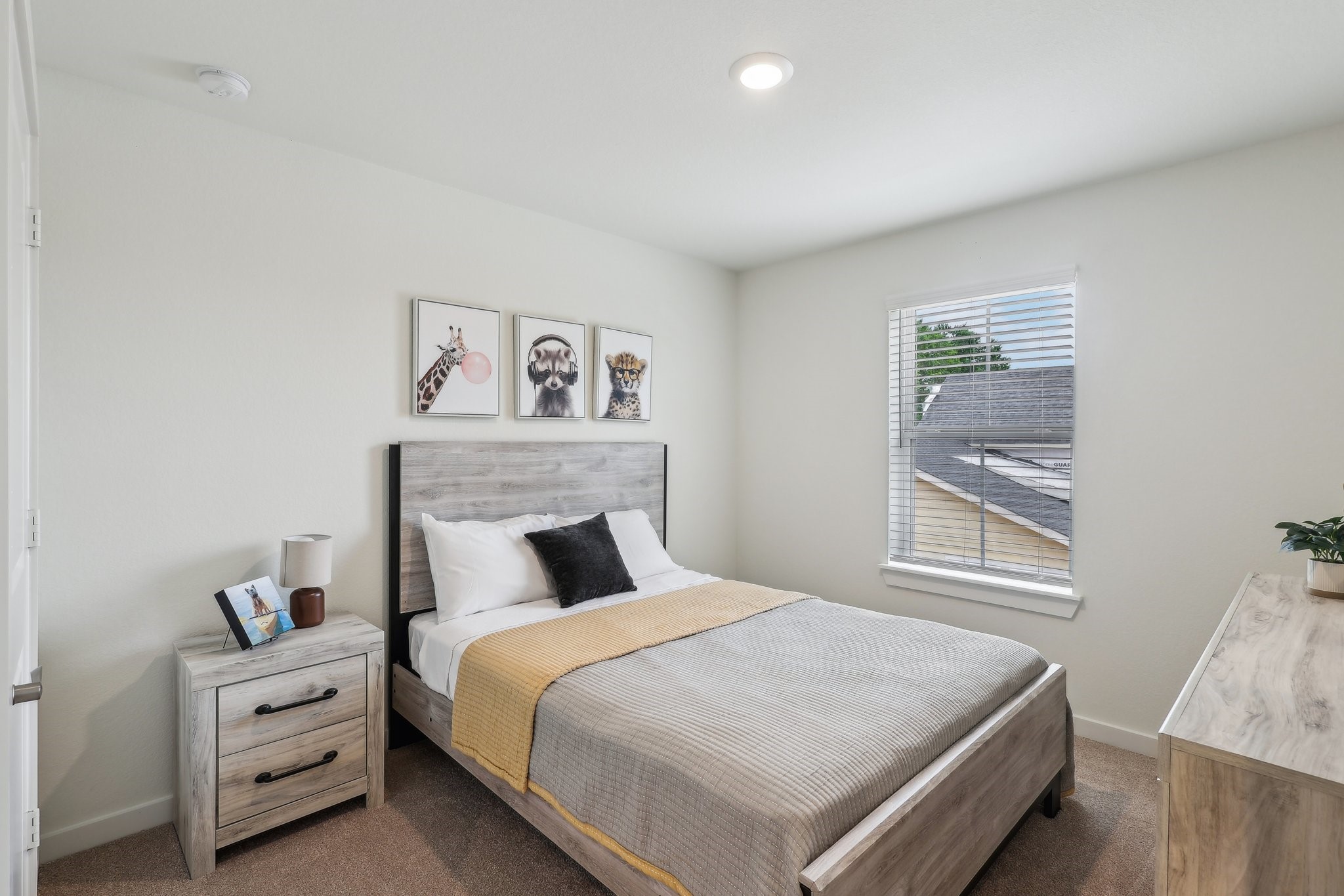 631 Canvas Avenue Fulshear, TX 77441 - Photo 18 of 30 a bedroom with a bed and a window