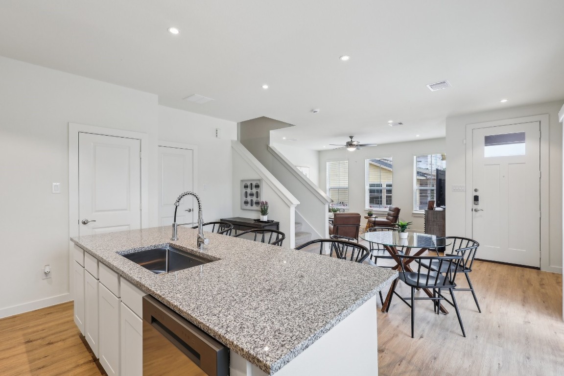 631 Canvas Avenue Fulshear, TX 77441 - Photo 9 of 30 a kitchen with sink table and chairs