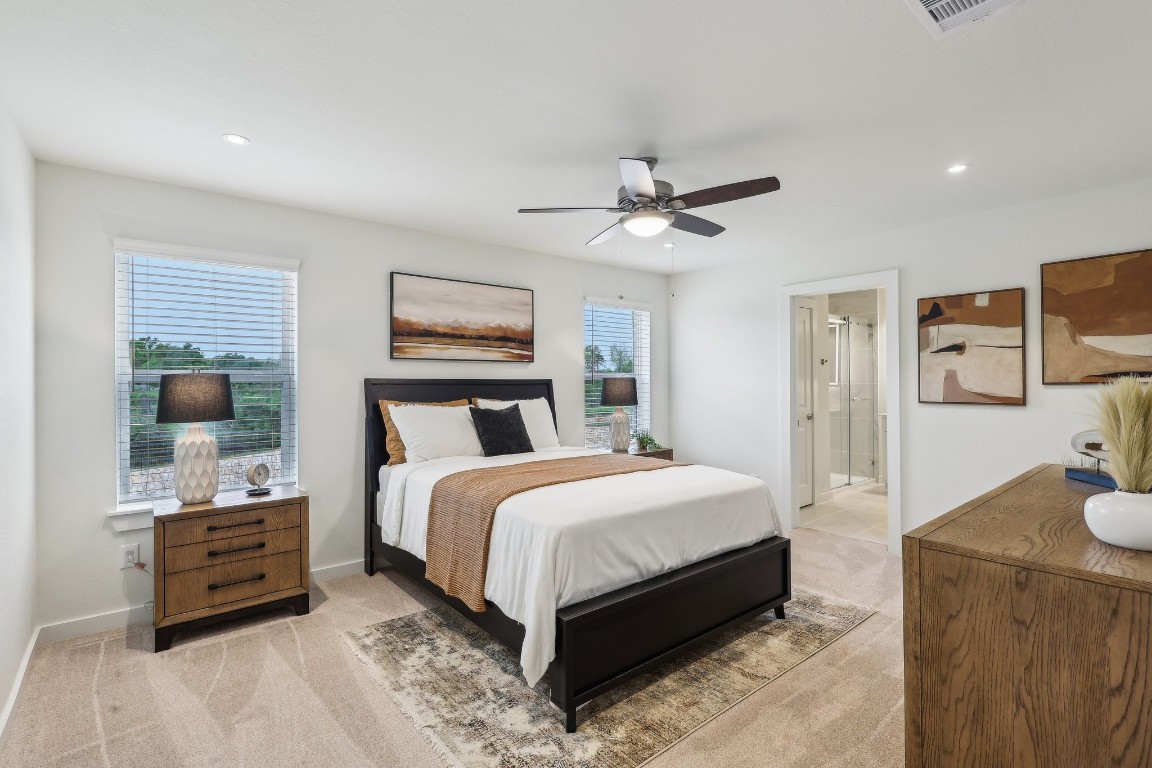 631 Canvas Avenue Fulshear, TX 77441 - Photo 10 of 30 a large bedroom with a bed and wooden floor