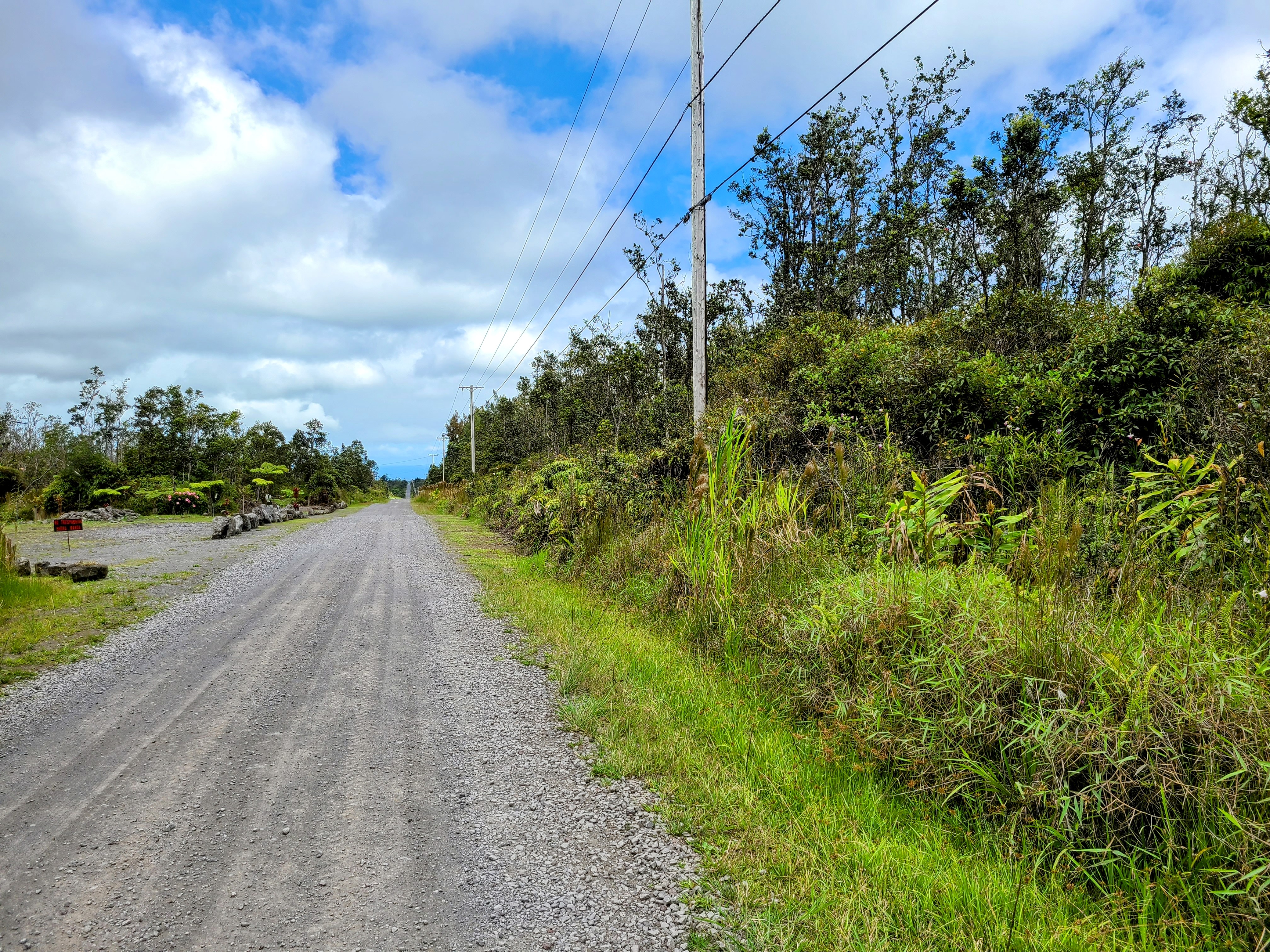 14 Kaleponi Road Mountain View, HI 96771 - Photo 3 of 12 a view of a road with a yard
