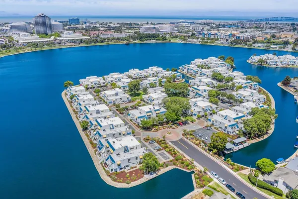 an aerial view of a house with a lake view