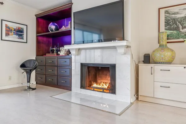 a view of fireplace with furniture