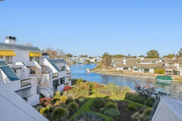 a bathroom with a granite countertop sink a mirror and a bathtub