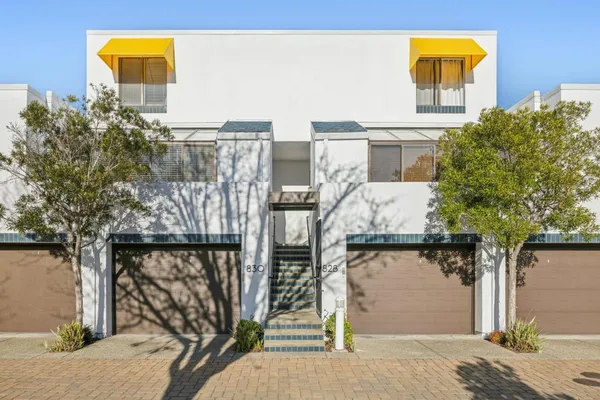 a front view of a house with parking