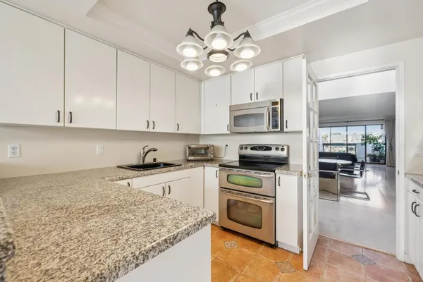 a kitchen with a stove microwave and refrigerator
