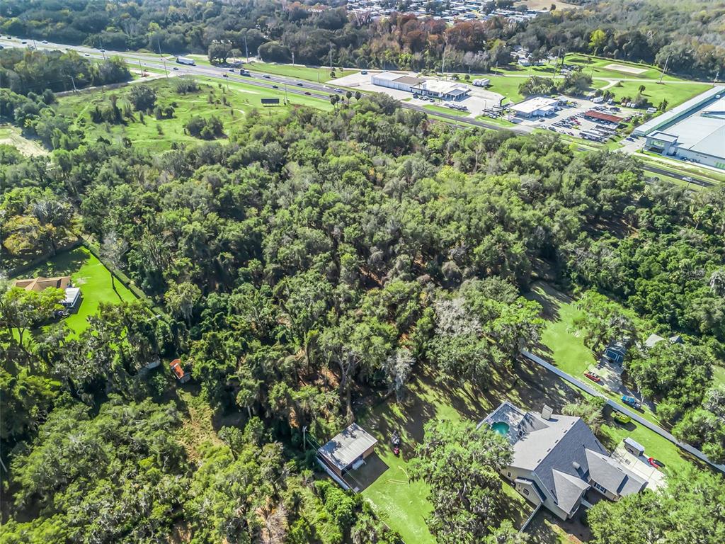 14th Street Leesburg, FL 34748 - Photo 7 of 26 an aerial view of residential houses with outdoor space and trees
