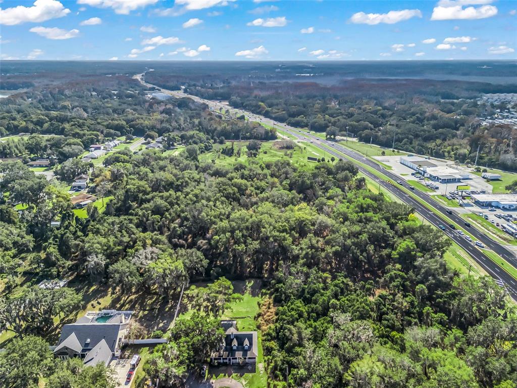 14th Street Leesburg, FL 34748 - Photo 9 of 26 a view of a garden with a building in the background