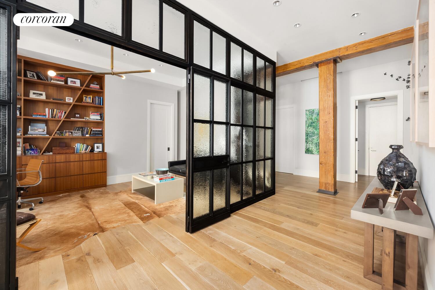 76 Crosby Street, Unit 4 Manhattan, NY 10012 - Photo 10 of 22 a view of a hallway with a livingroom and furniture
