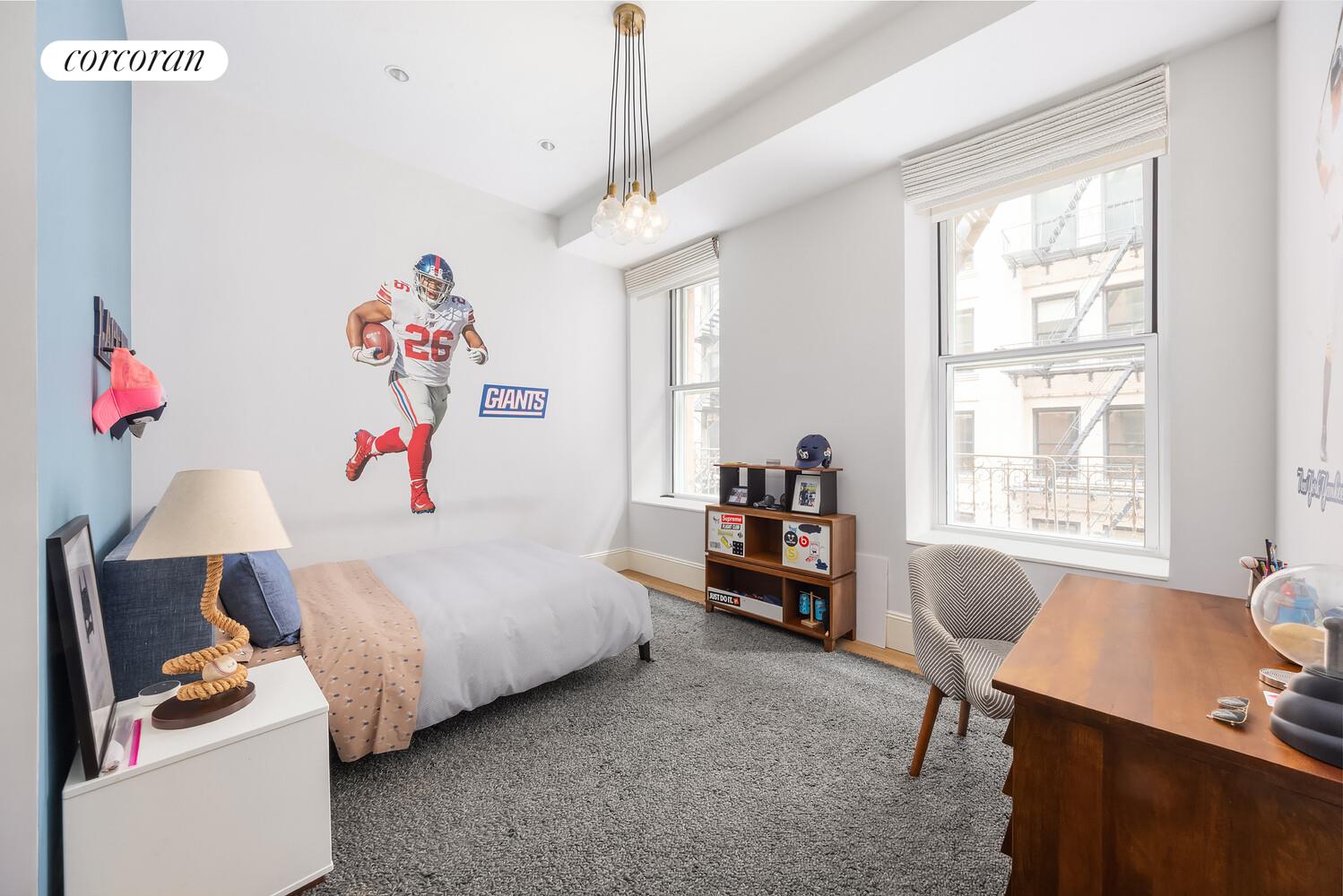 76 Crosby Street, Unit 4 Manhattan, NY 10012 - Photo 15 of 22 a bedroom with a bed and a window
