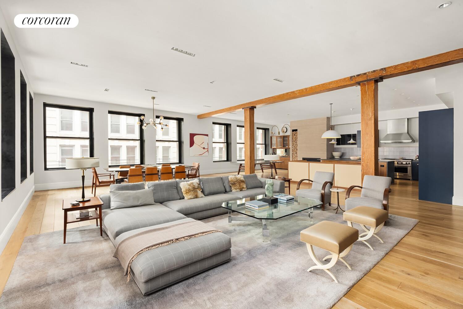 76 Crosby Street, Unit 4 Manhattan, NY 10012 - Photo 2 of 22 a living room with furniture wooden floor and large windows
