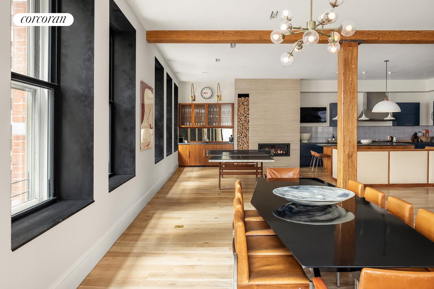 76 Crosby Street, Unit 4 Manhattan, NY 10012 - Photo 7 of 22 a kitchen with a table and chairs