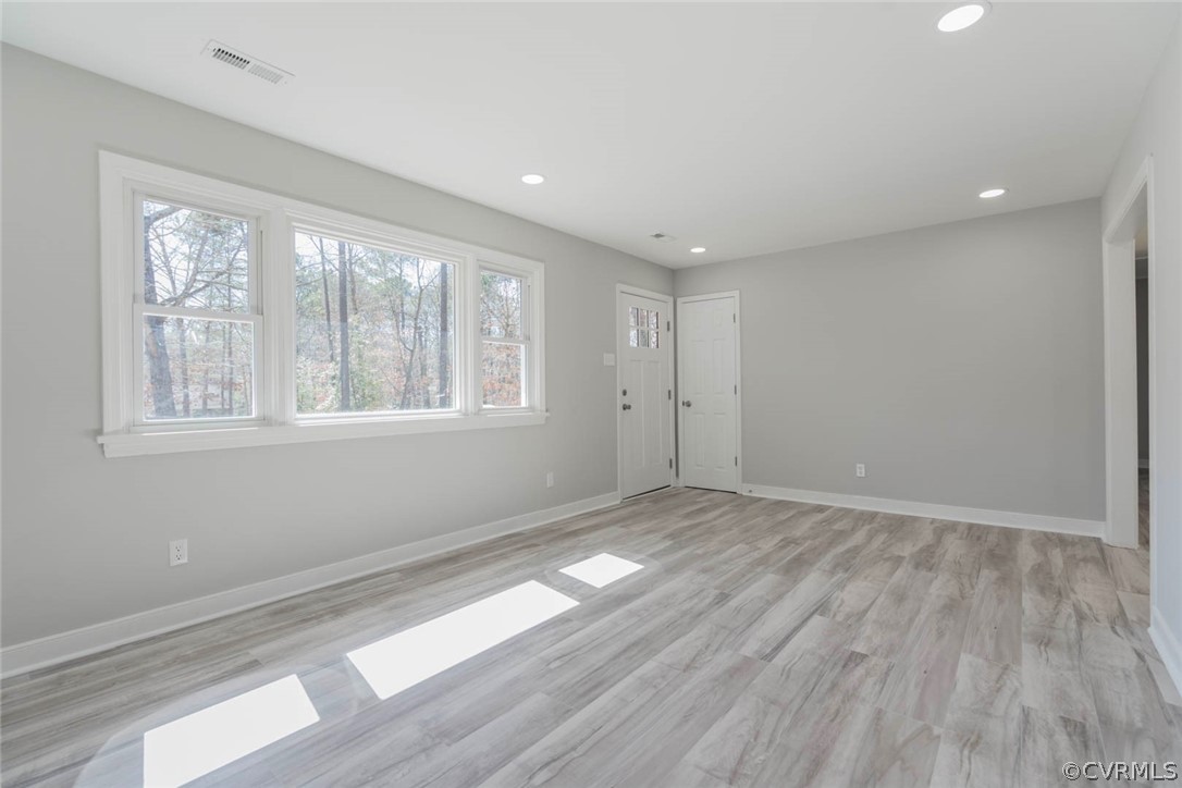 238 Monath Road North Chesterfield, VA 23236 - Photo 14 of 32 a view of empty room with wooden floor and fan