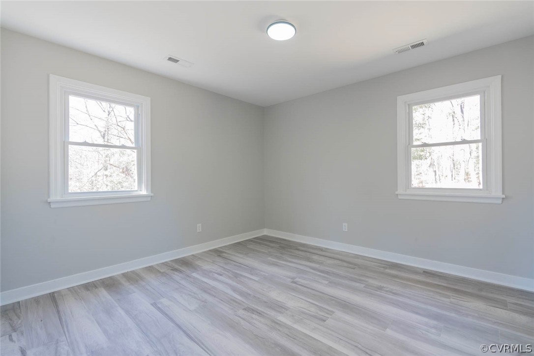238 Monath Road North Chesterfield, VA 23236 - Photo 20 of 32 an empty room with wooden floor and windows