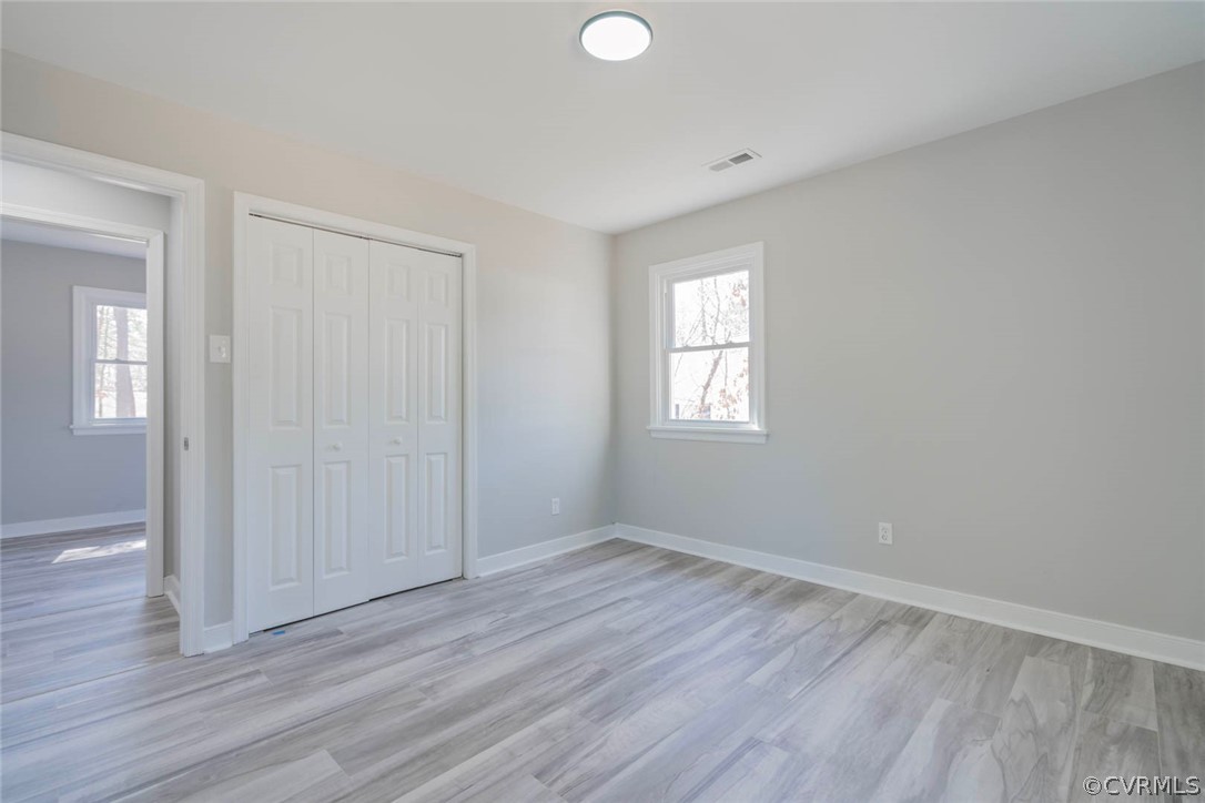 238 Monath Road North Chesterfield, VA 23236 - Photo 21 of 32 an empty room with wooden floor and windows