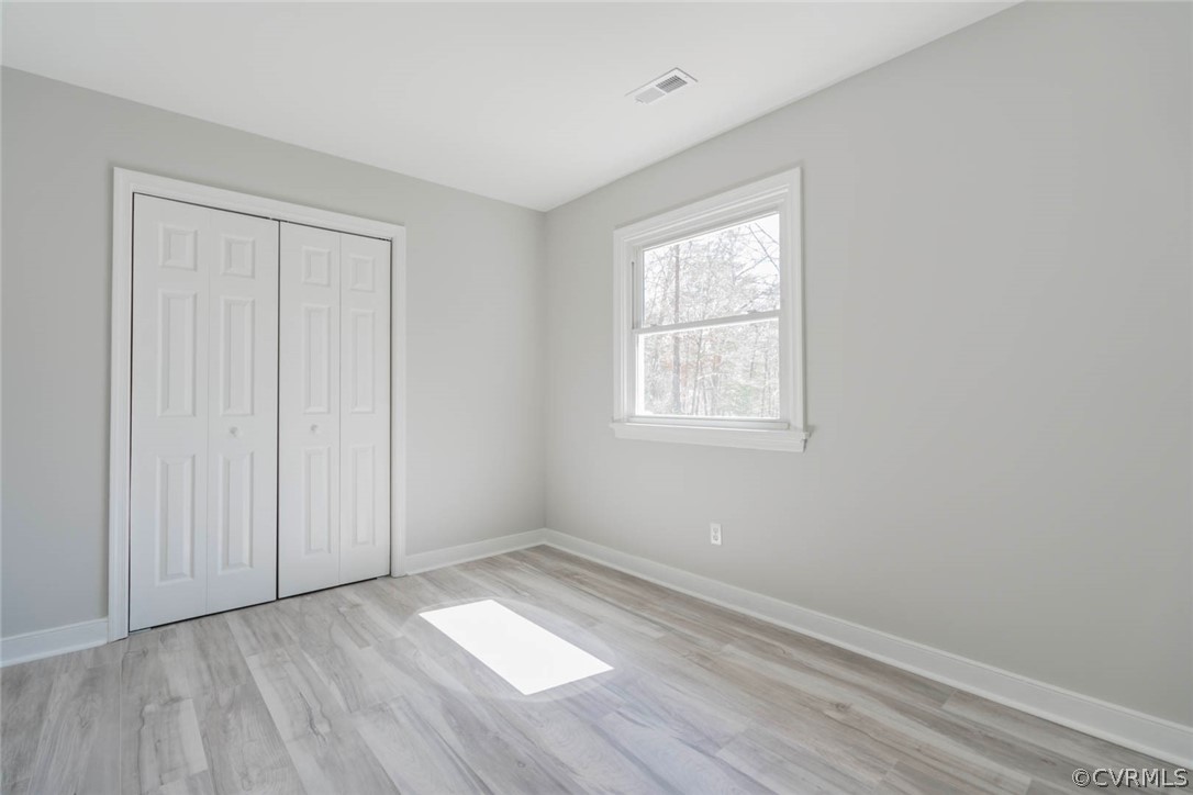 238 Monath Road North Chesterfield, VA 23236 - Photo 23 of 32 an empty room with wooden floor and windows