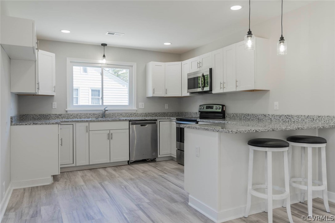 238 Monath Road North Chesterfield, VA 23236 - Photo 4 of 32 a kitchen with granite countertop a sink and cabinets