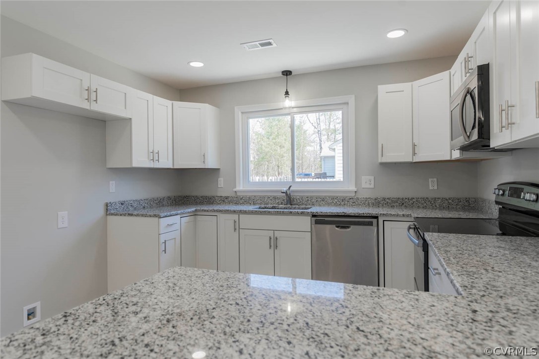 238 Monath Road North Chesterfield, VA 23236 - Photo 7 of 32 a kitchen with granite countertop a sink window and cabinets