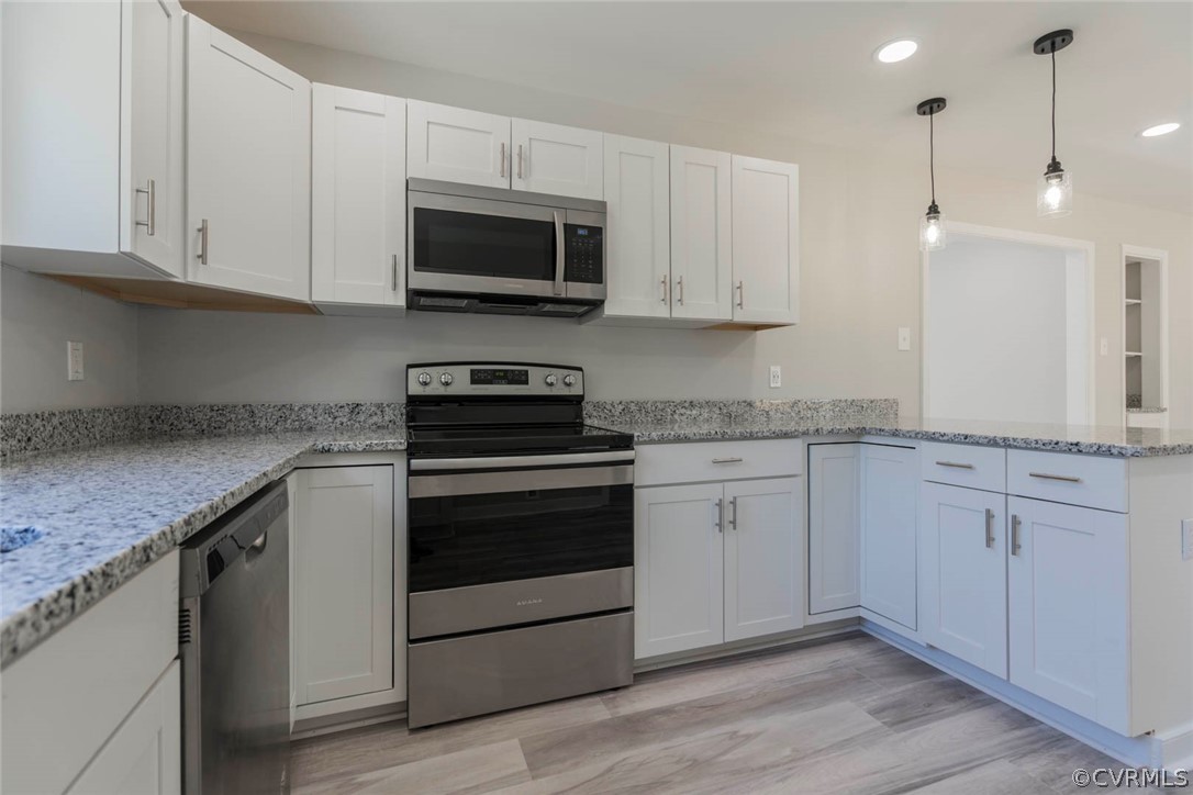 238 Monath Road North Chesterfield, VA 23236 - Photo 8 of 32 a kitchen with granite countertop white cabinets stainless steel appliances and a sink