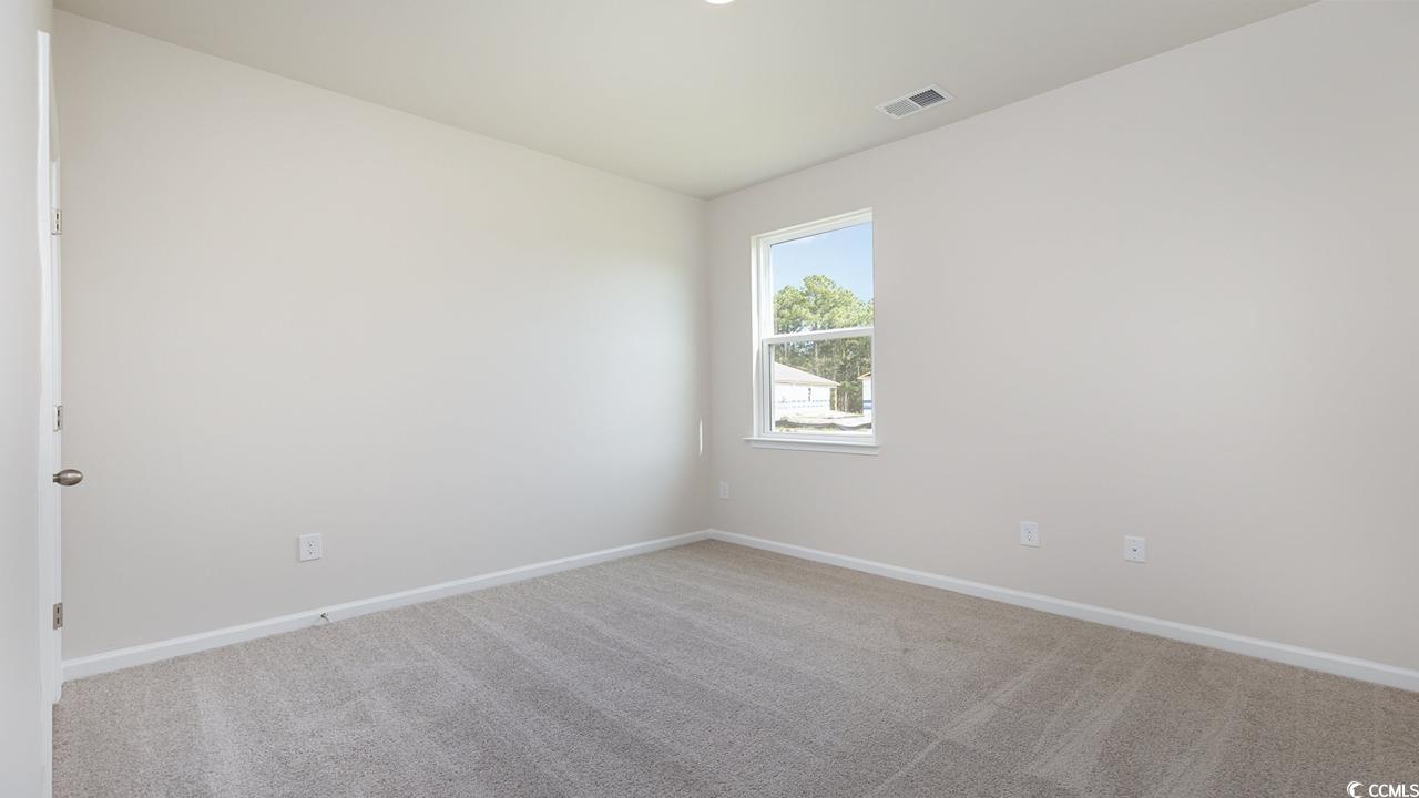 202 Dagger Court Myrtle Beach, SC 29588 - Photo 19 of 33 Empty room featuring carpet flooring and baseboards