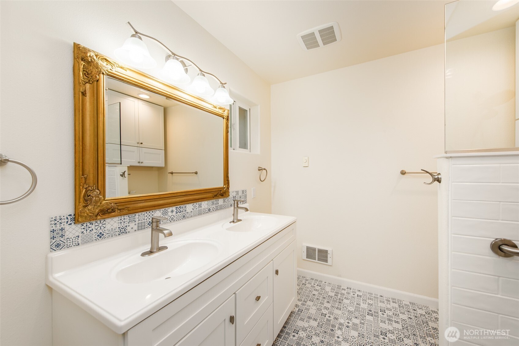 315 Dungeness Meadows Sequim, WA 98382 - Photo 17 of 36 a bathroom with a sink and a mirror