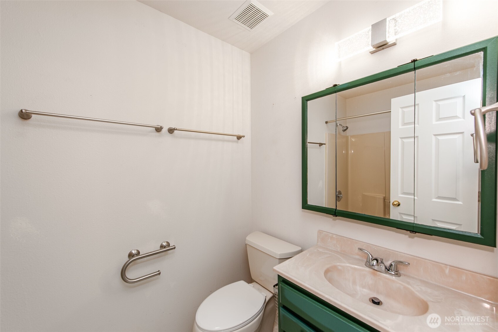 315 Dungeness Meadows Sequim, WA 98382 - Photo 22 of 36 a bathroom with a sink vanity mirror and toilet
