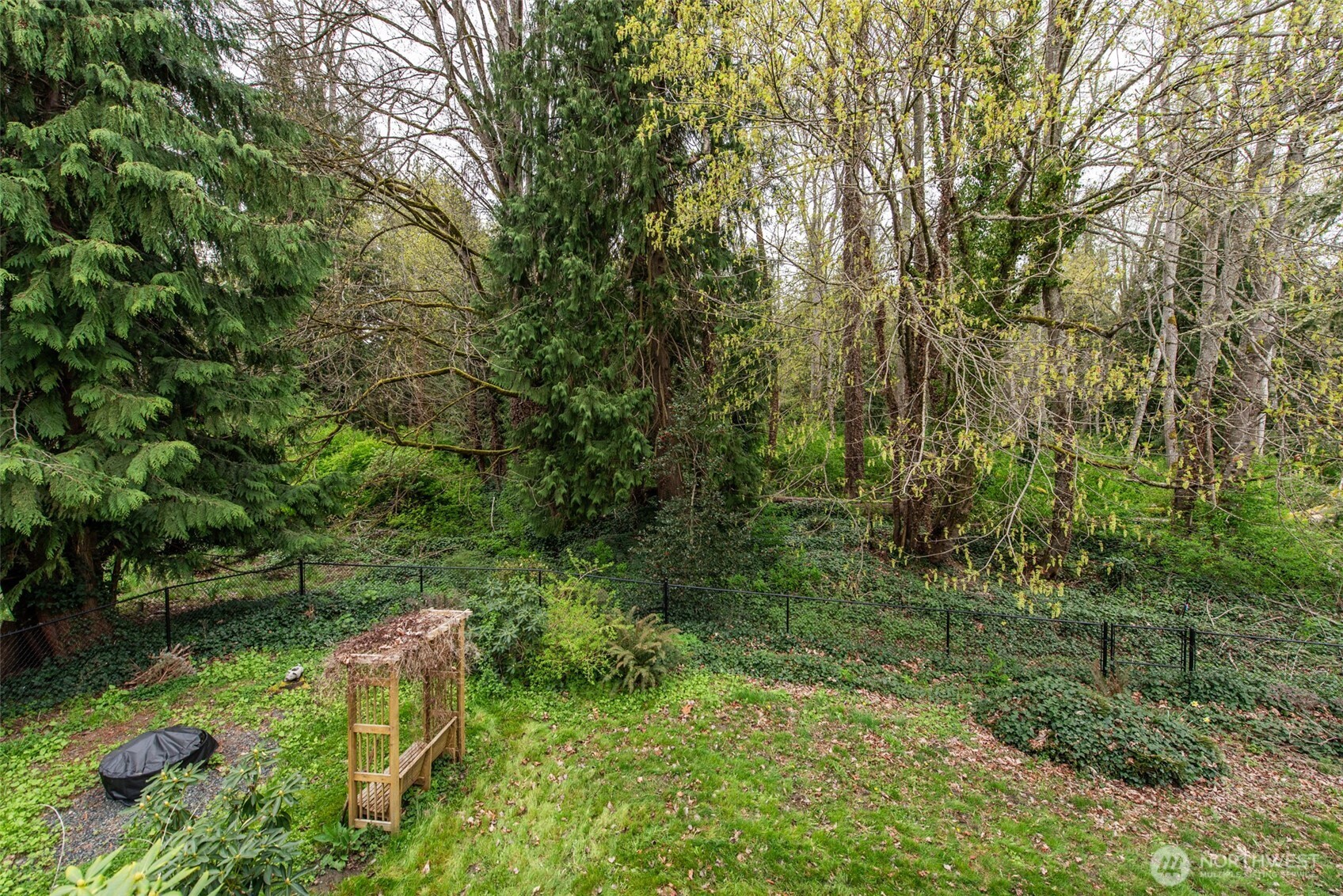 315 Dungeness Meadows Sequim, WA 98382 - Photo 30 of 36 a backyard of a house with a yard and seating area