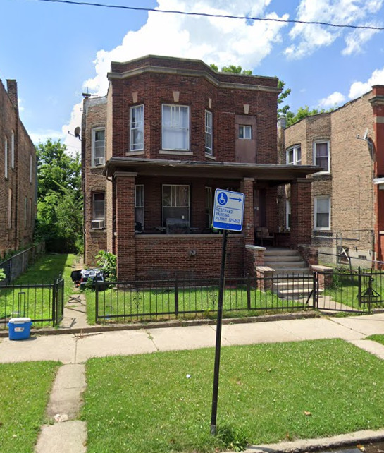 7348 South Lowe Avenue Chicago, IL 60621 - Photo 1 of 1 a front view of a house with a yard