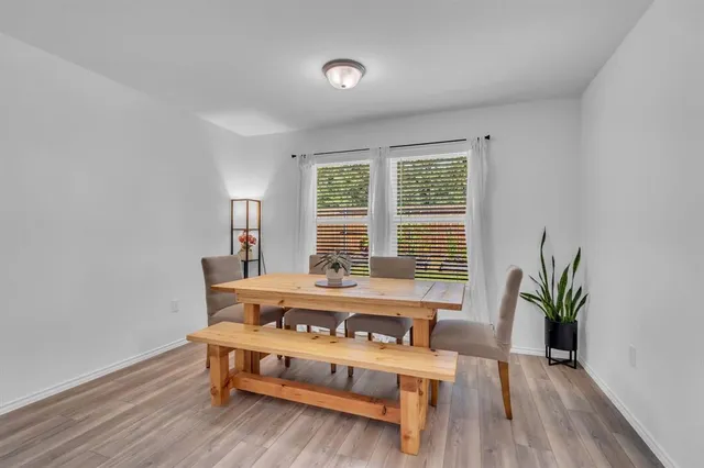 a view of living room kitchen with stainless steel appliances kitchen island