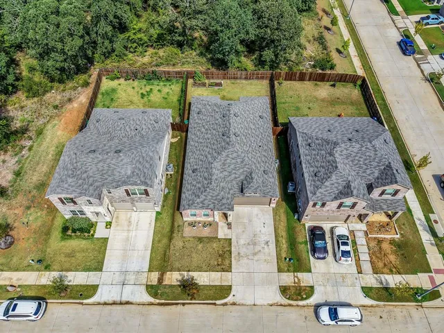 a view of a house with swimming pool in front of it