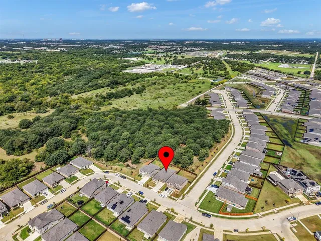 a aerial view of a house with a yard