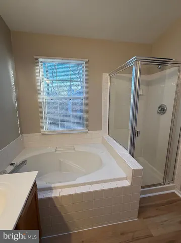 a bathroom with a bathtub and a sink