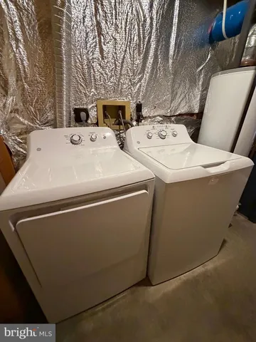 a utility room with washer and dryer