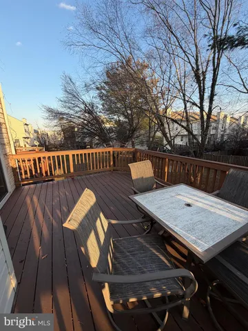 a view of a wooden deck with furniture
