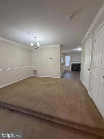 an empty room with a fireplace