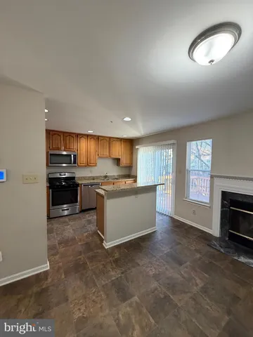 a large kitchen with a stove top oven a sink and dishwasher