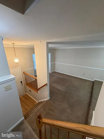 a view of a hallway with staircase
