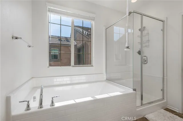 a bathroom with a bathtub and shower