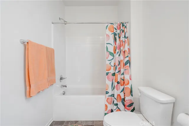 a bathroom with a bathtub and toilet