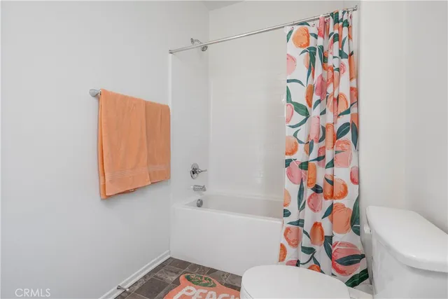 a bathroom with a granite countertop sink mirror and a window