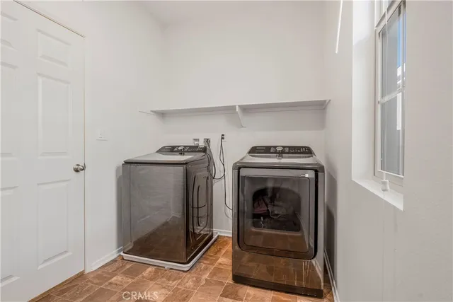 a backyard of a house with outdoor seating